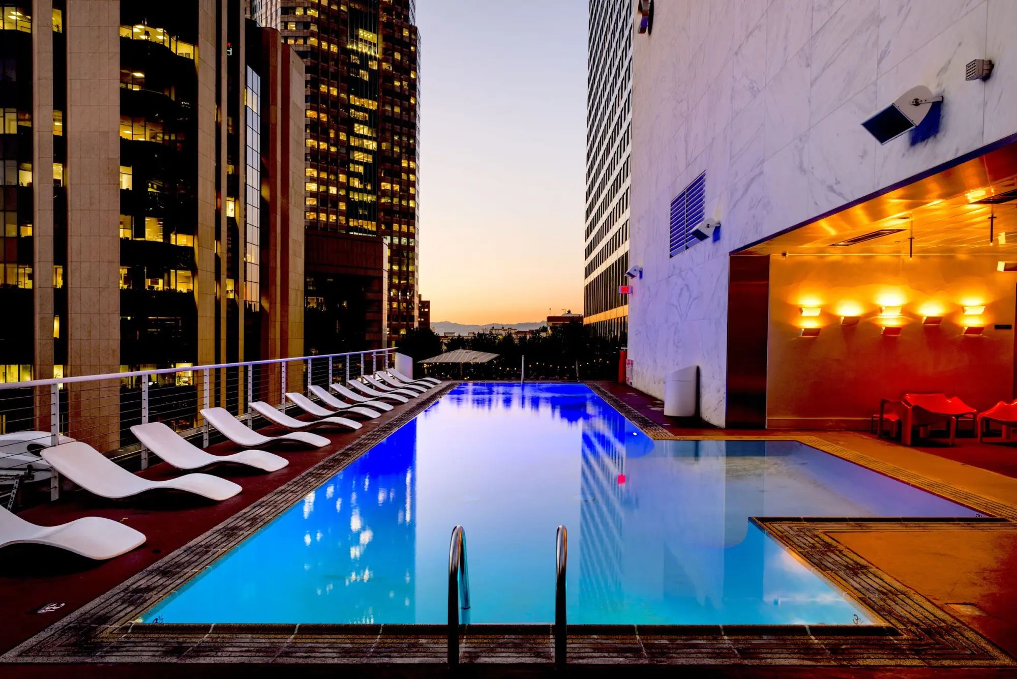 A pool at dusk, lit from within